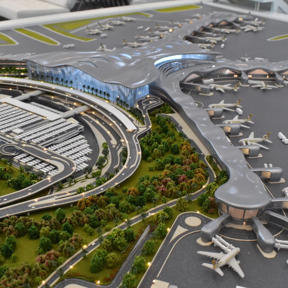 3D printed airport model with terminal, planes, and greenery